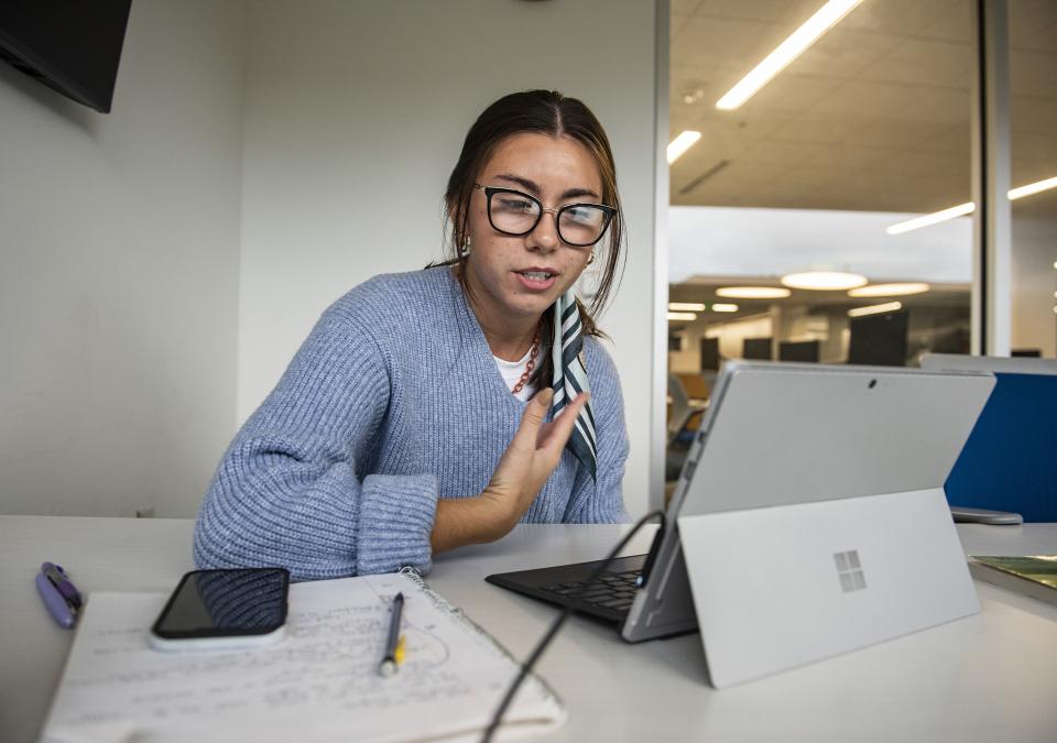 Olivia Jovevski teaches an online English class to students in Myanmar.