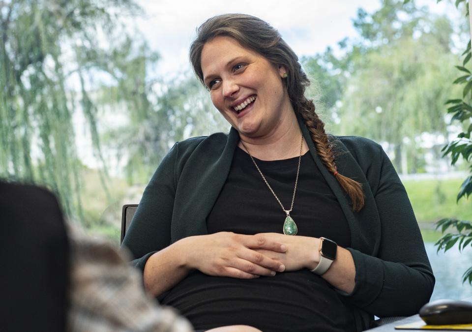 Meg Underwood counsels students in her office