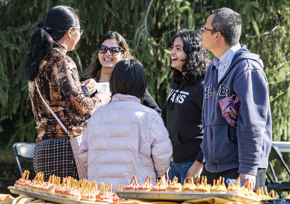 faculty and staff chat at the Mastodon Family Picnic