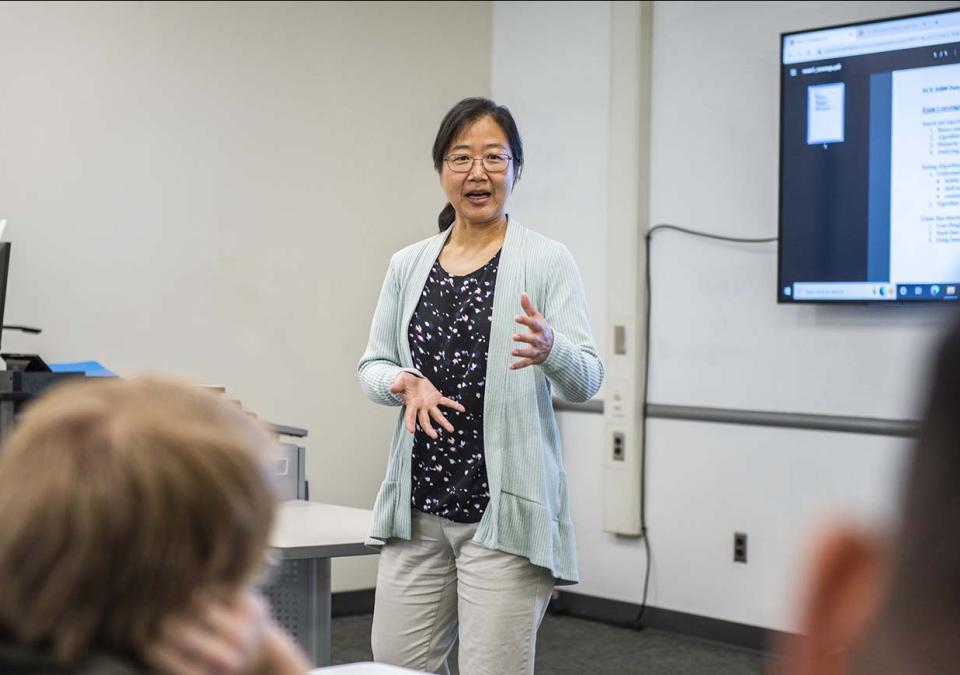 Professor Chao Chen teaching in a classroom