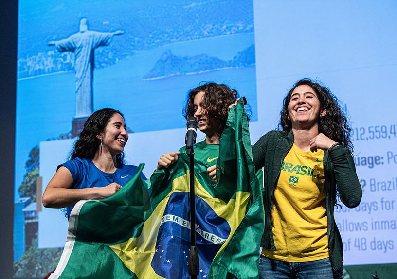 International students from Brazil display their country's flag