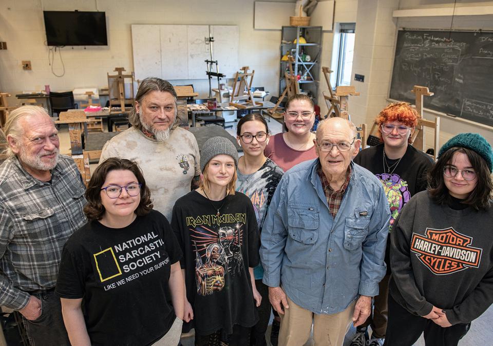 Alan Grinsfelder with members of his painting class.