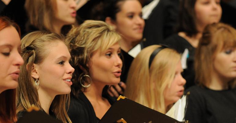 close up picture of women singing 