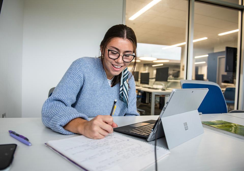 A student studies in the library.