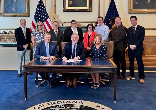 Gov. Eric Holcomb is signing a bill into law.