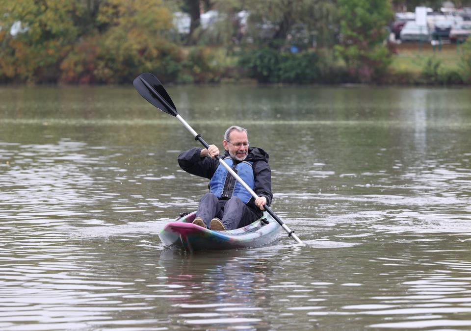 Dean Ronald Friedman is rowing a kayak