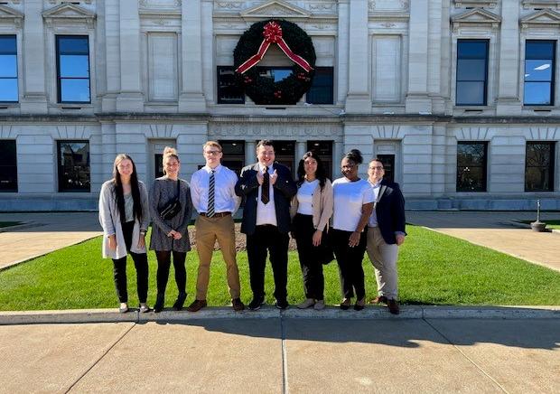 A law, ethics, ad professionalism class is outside the Allen County Courthouse.