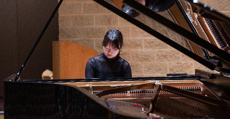 woman playing piano