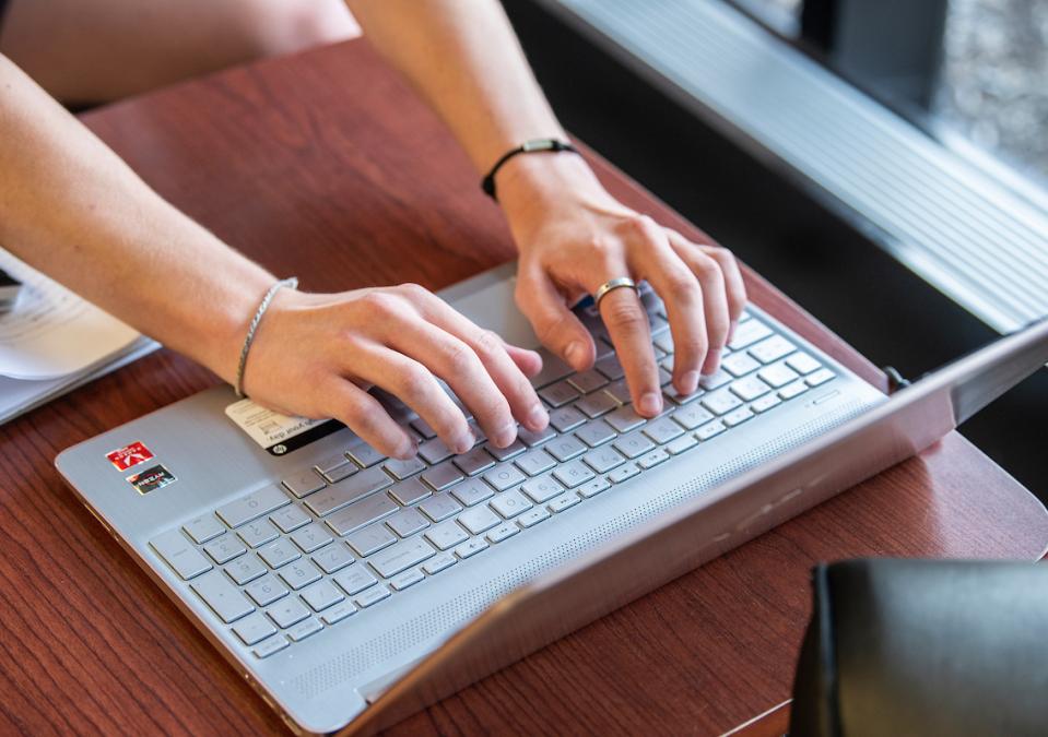 Someone is typing on a laptop computer.