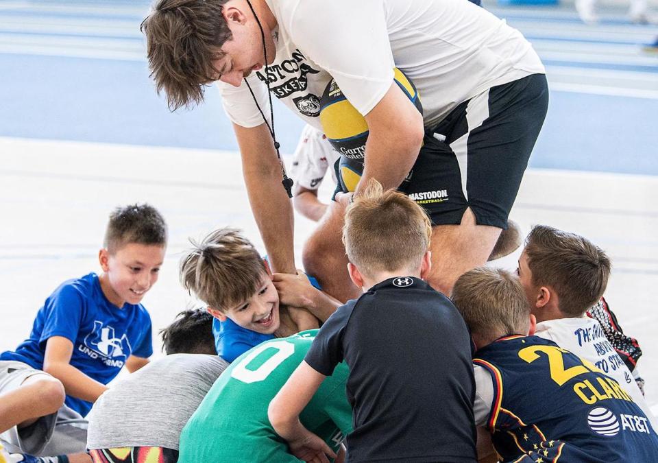 Students scrambling for the ball at basketball camp