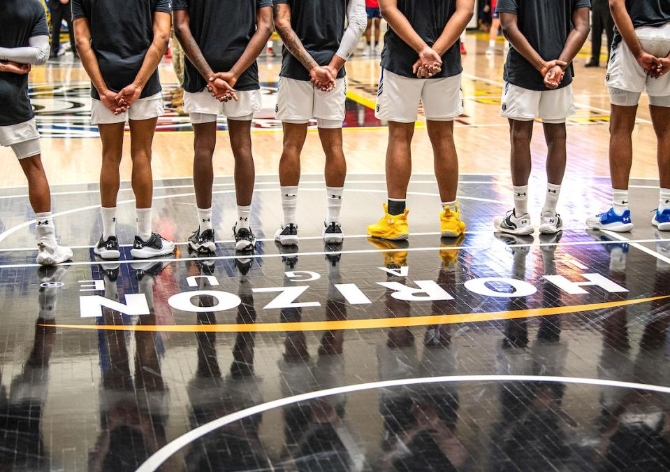 Basketball team lined up at the free throw line