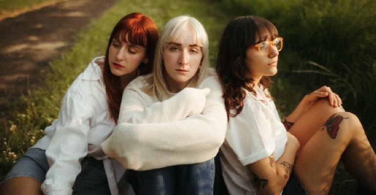 three women in a feild