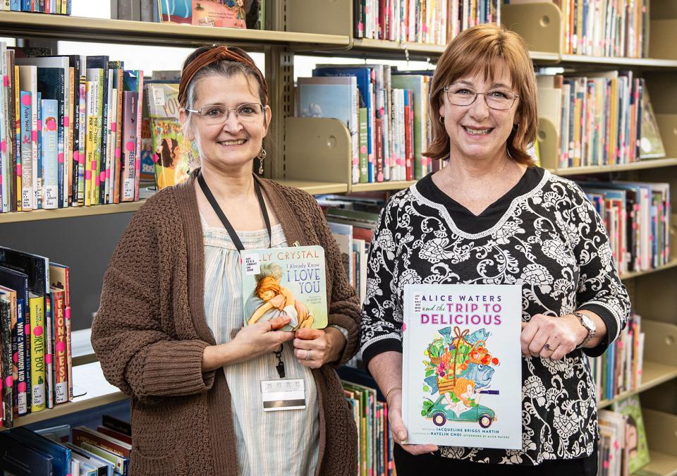 Emily Tock and Elizabeth Christian display children’s books