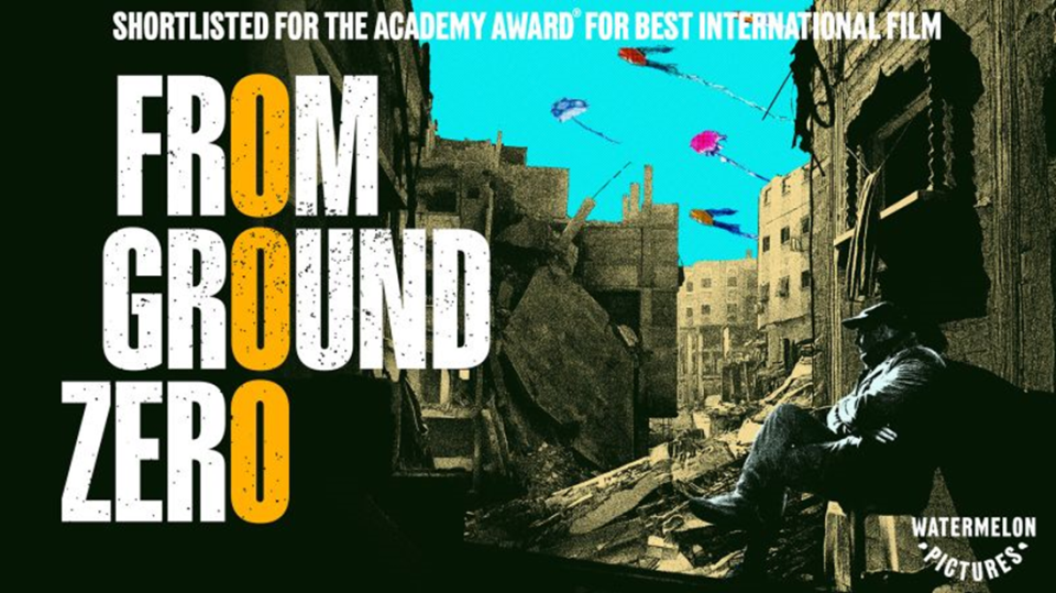 Poster showing the movie title "From Ground Zero" and text "Shortlisted for the Academy Award for Best International Film"; the background is a silhouetted person sitting among ruined, war-torn buildings.