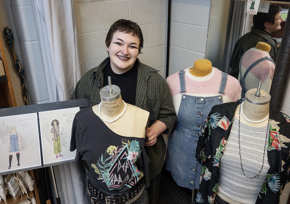 Rin Ulick with some of the costumes they designed