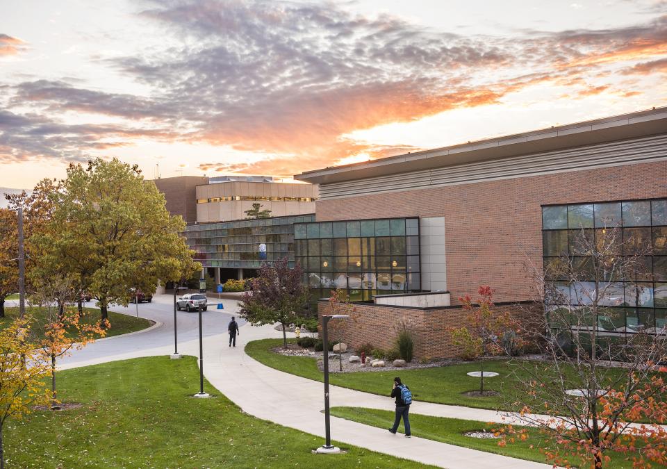 Campus sunset over walb union, helmke library, and the skybridge connecting the two buildings.