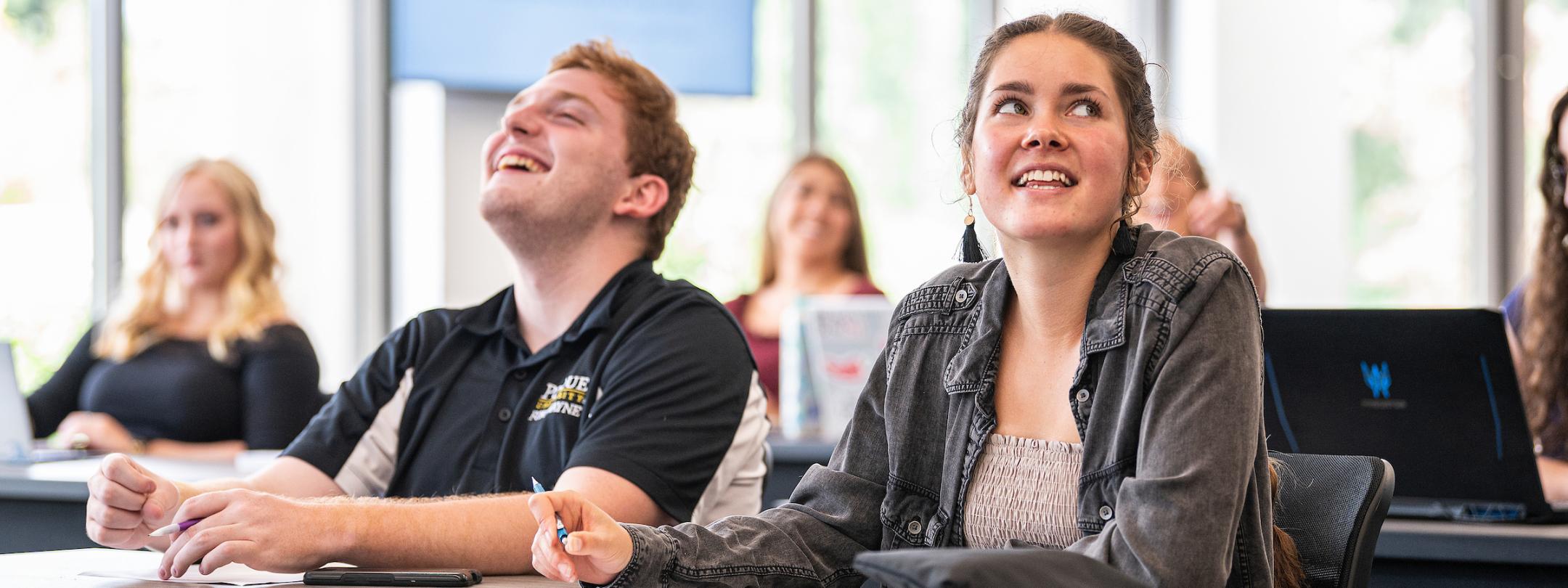 Students enjoy a lecture.