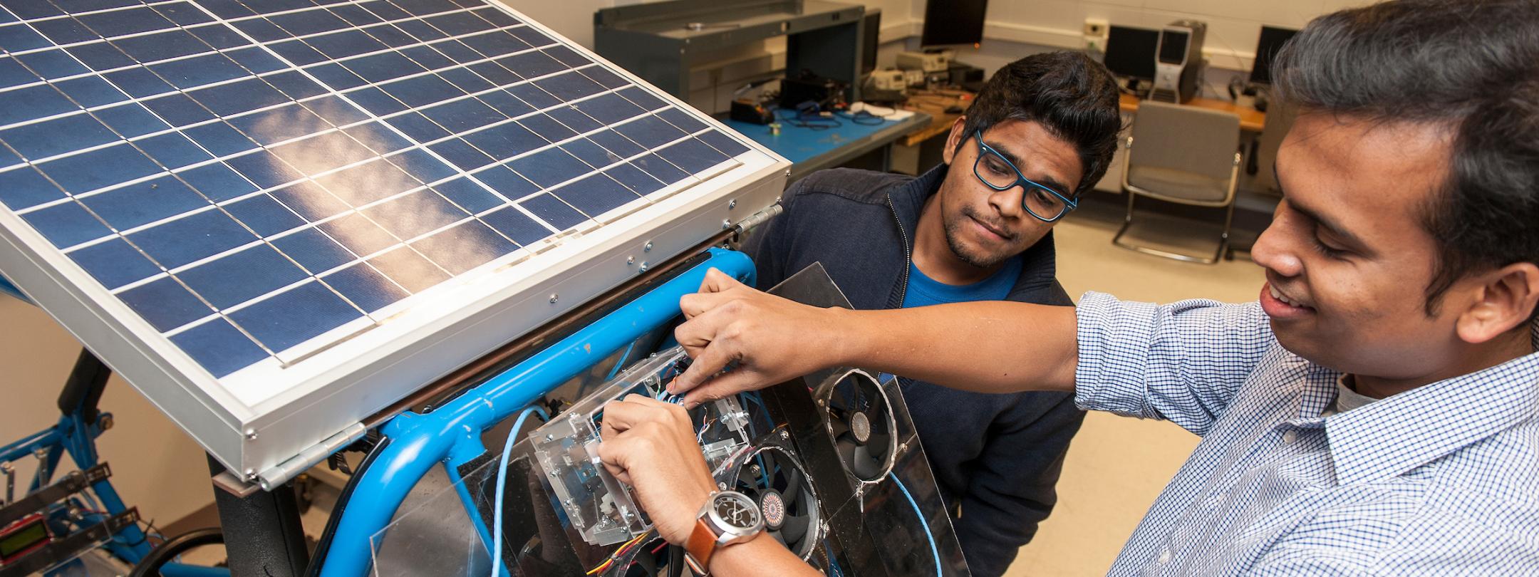 Students working on solar panel