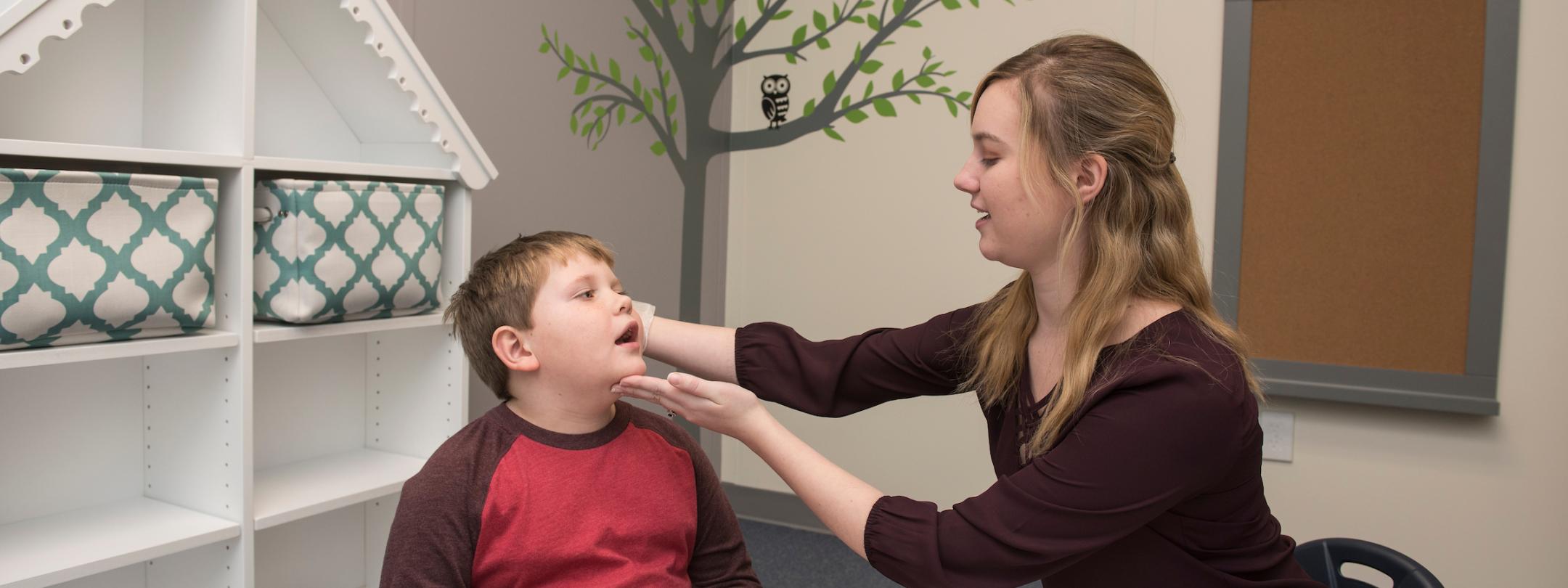 Student and child doing exercise