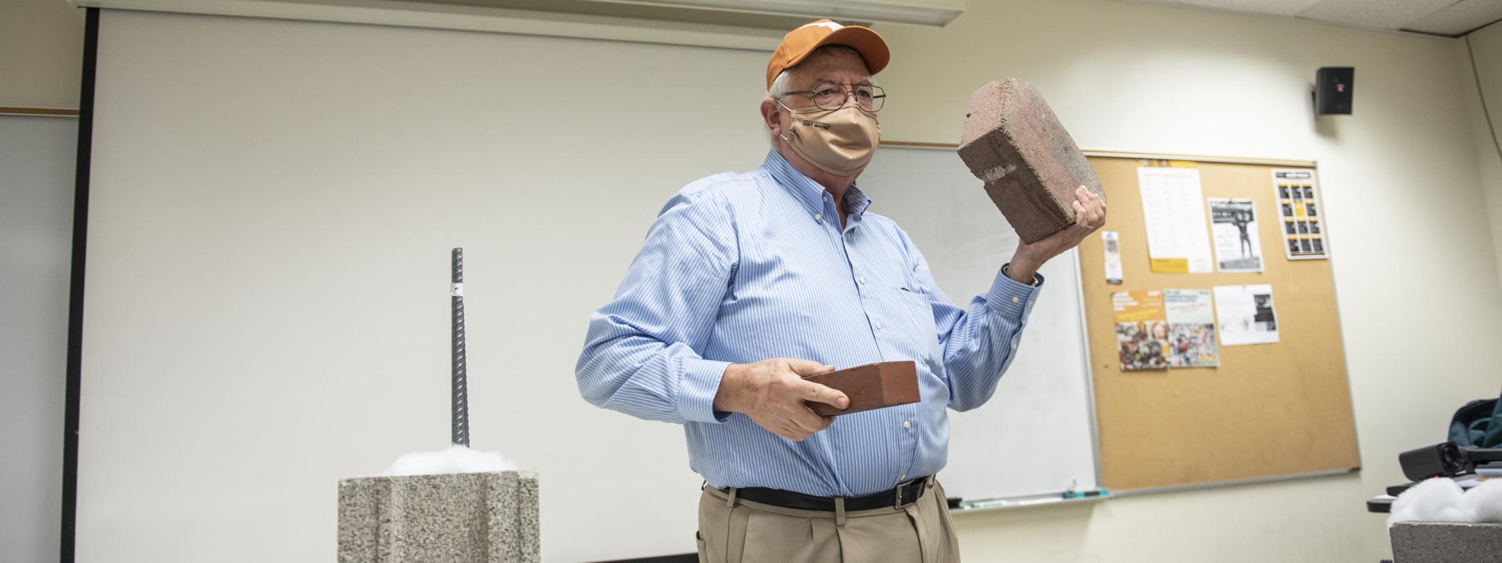 Professor lecturing in polytech classroom.