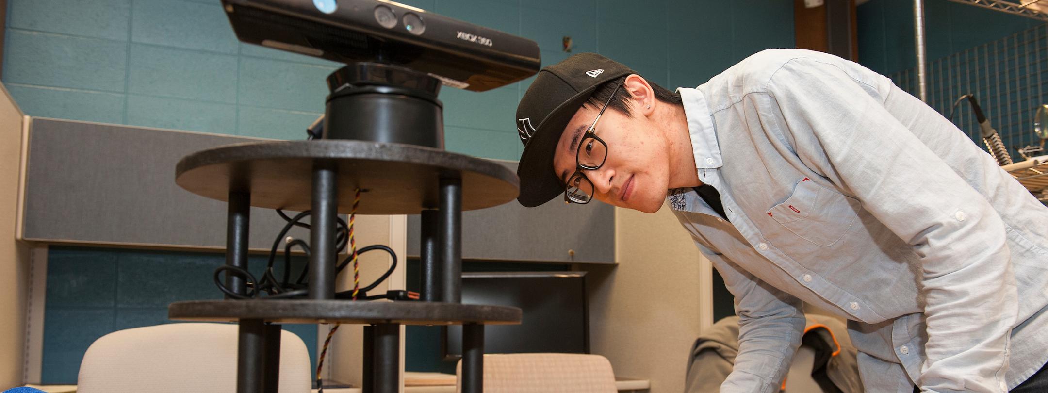 Student looking at equipment