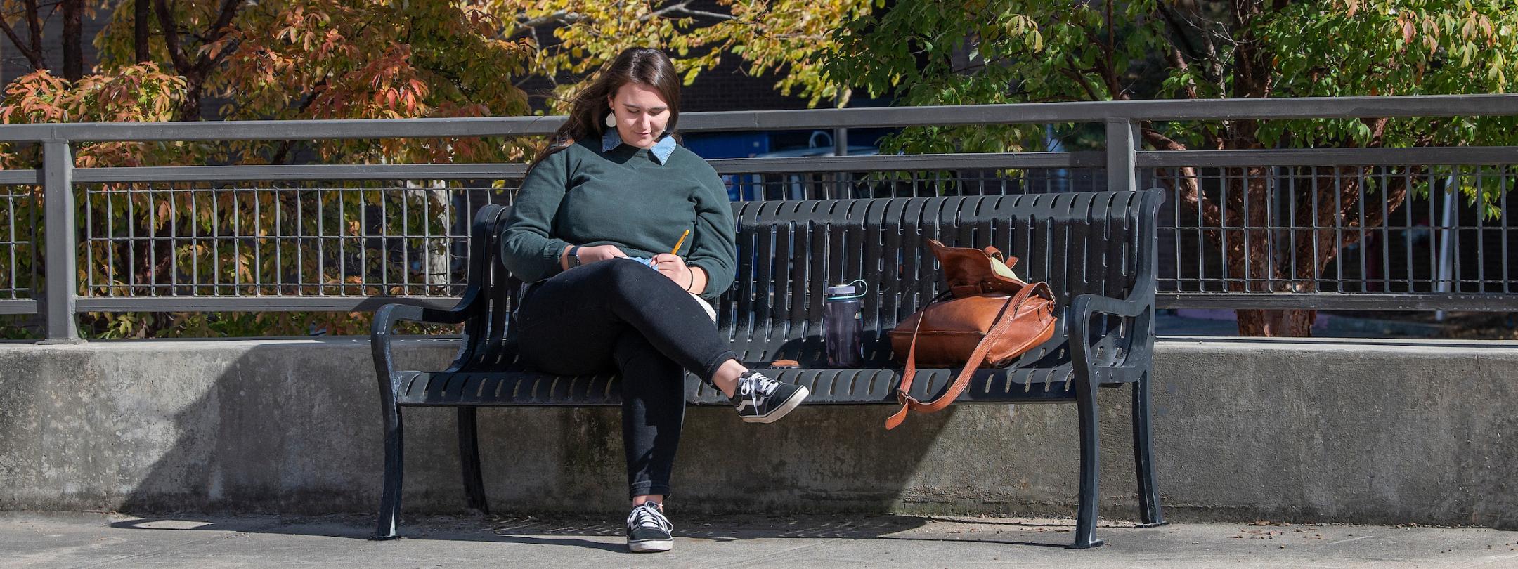 Student studying outdoors