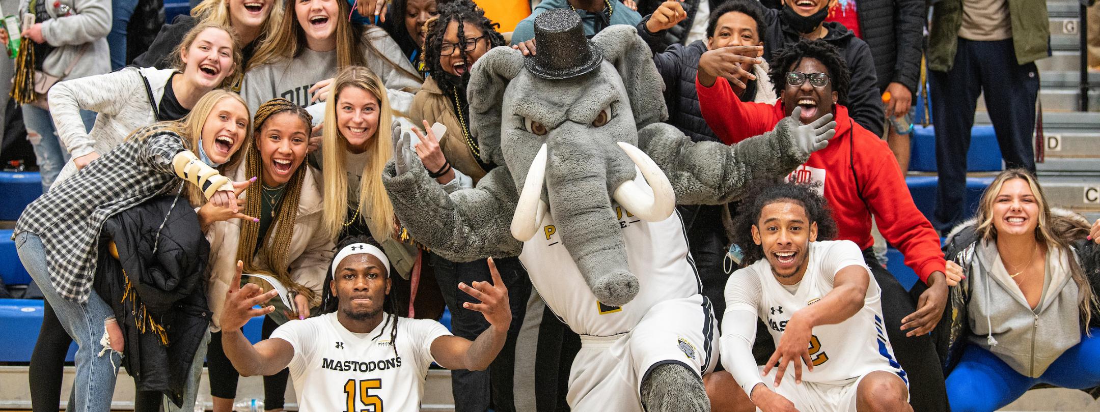 Basketball players with crowd