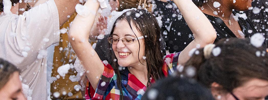 Lilly Stotlar is dancing in foam bubbles.