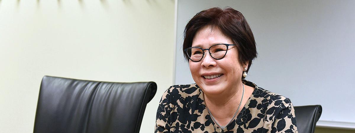 Portrait of Sheena Choi sitting at a desk