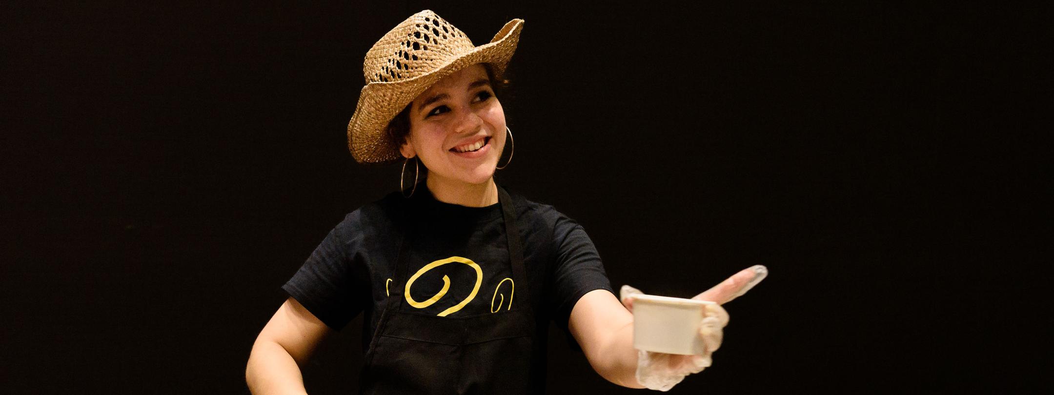 Sydney Coyne is serving chili at the chancellor's chili fest