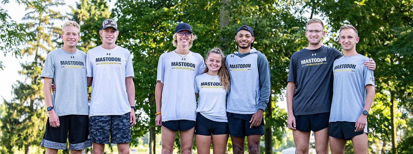 Seven cross country teams members who are twins