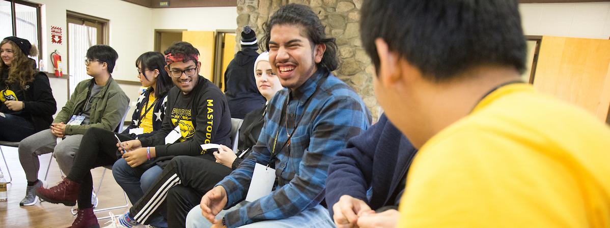 Students sitting in a circle during a leadership retreat.