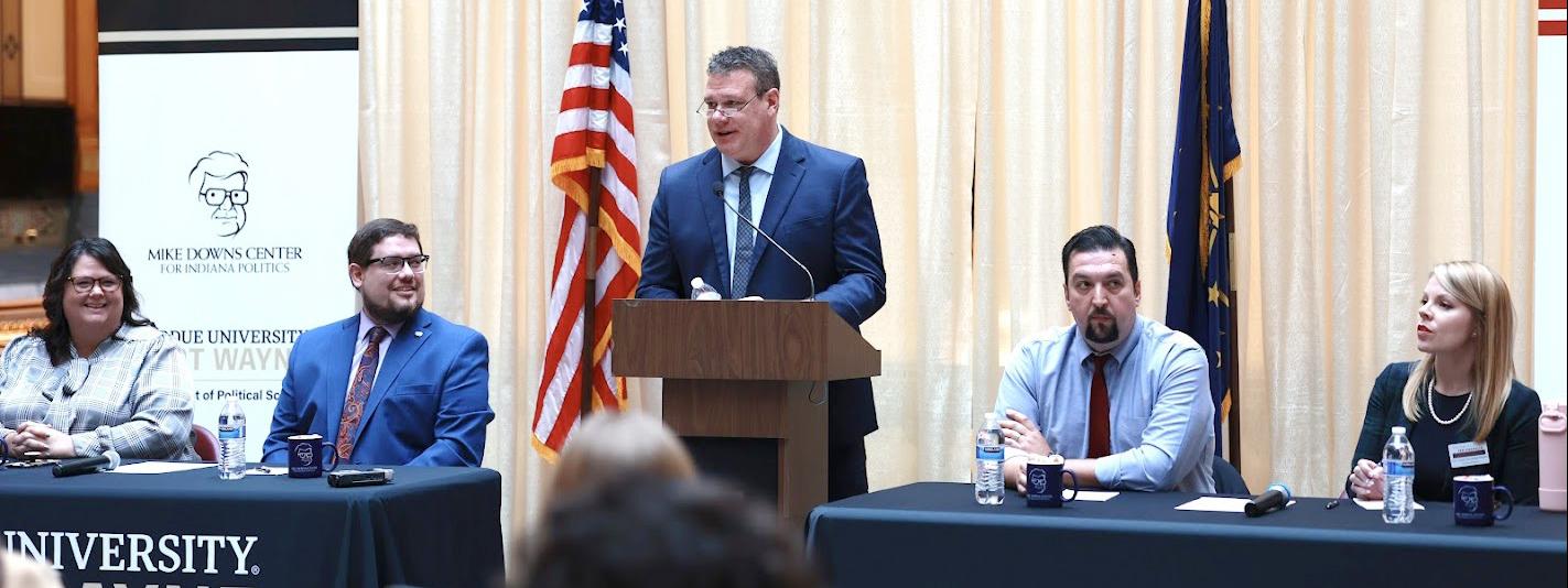 Michael Wolf is leading a panel discussion at the Indiana Statehouse