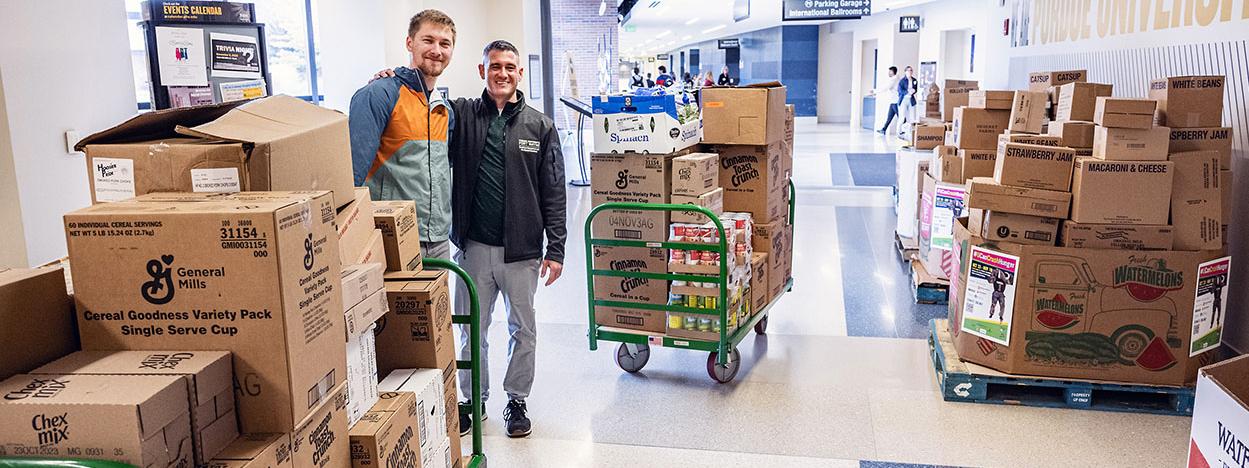 Boxes of food fill a hallway