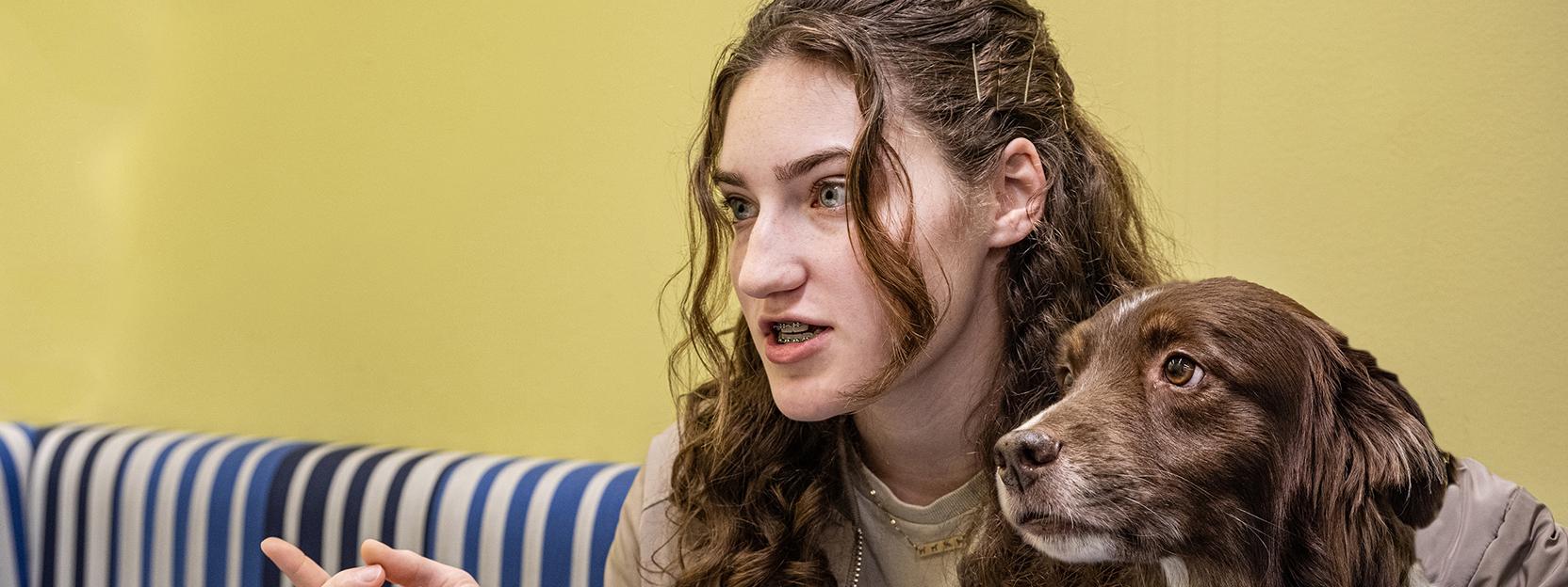 Emily Wentland and her therapy dog, Gunner.