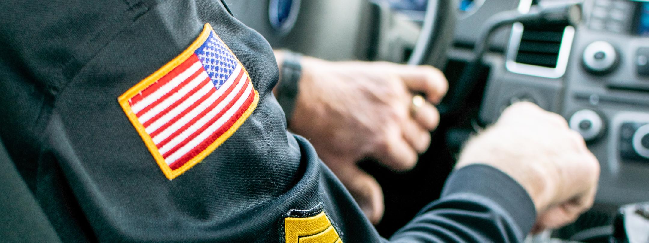 University PD officer in a patrol car.