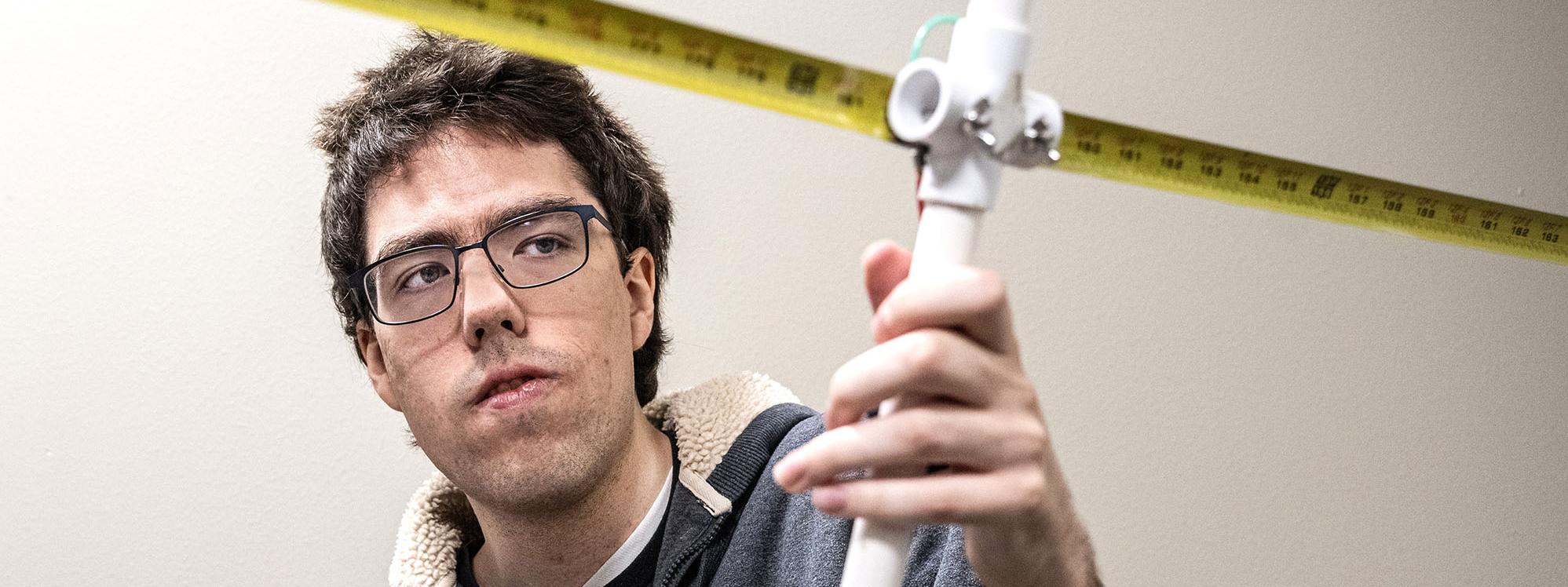 Andrew Danielson and his wildlife telemetry antenna.