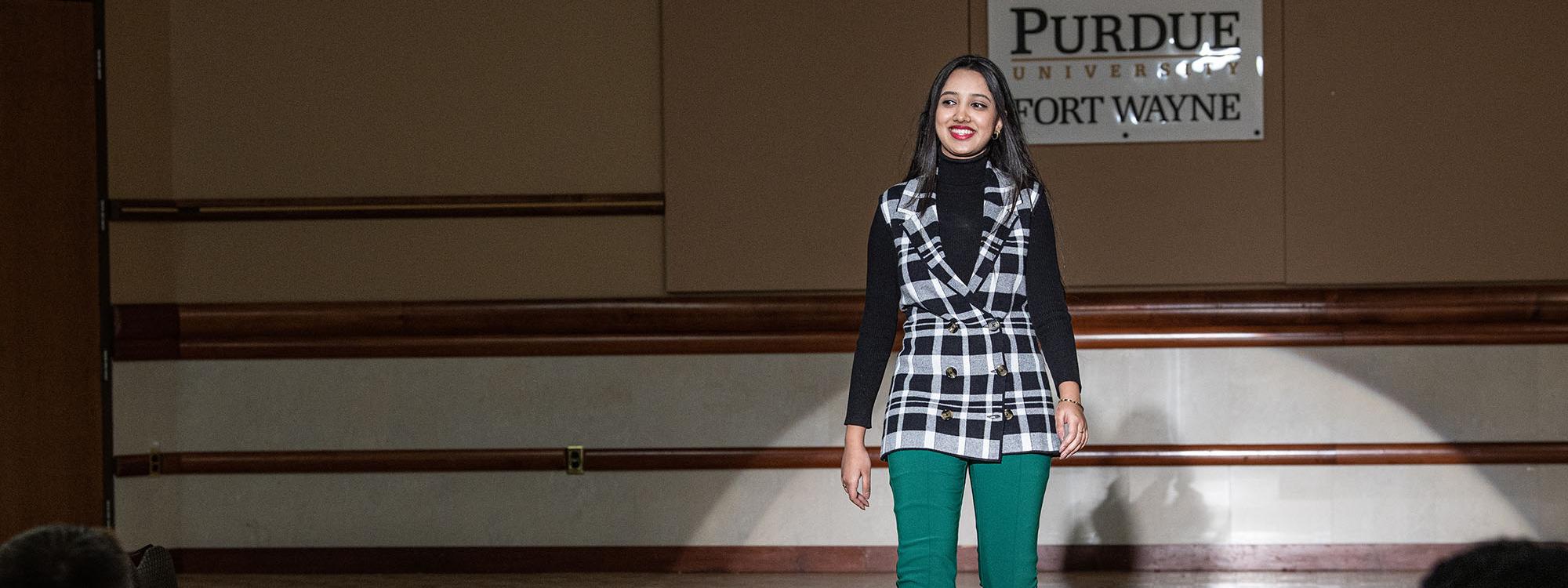 A student walks the runway during the Career Center fashion show at Purdue Fort Wayne.