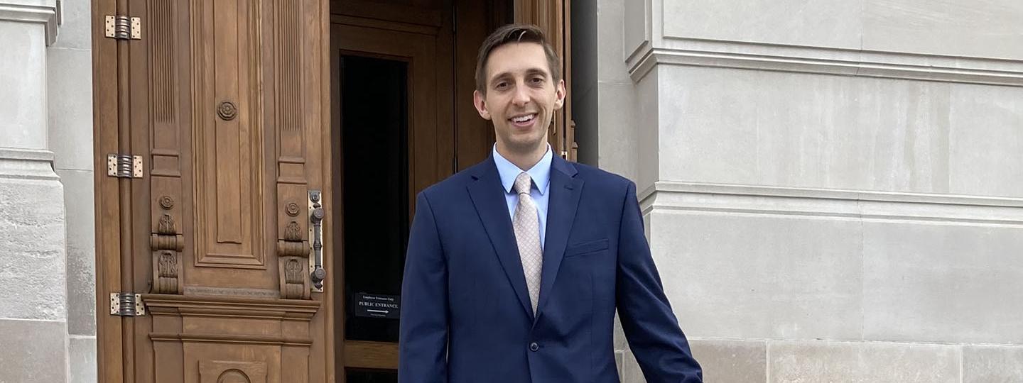 Ben Bailey on the steps of a courthouse