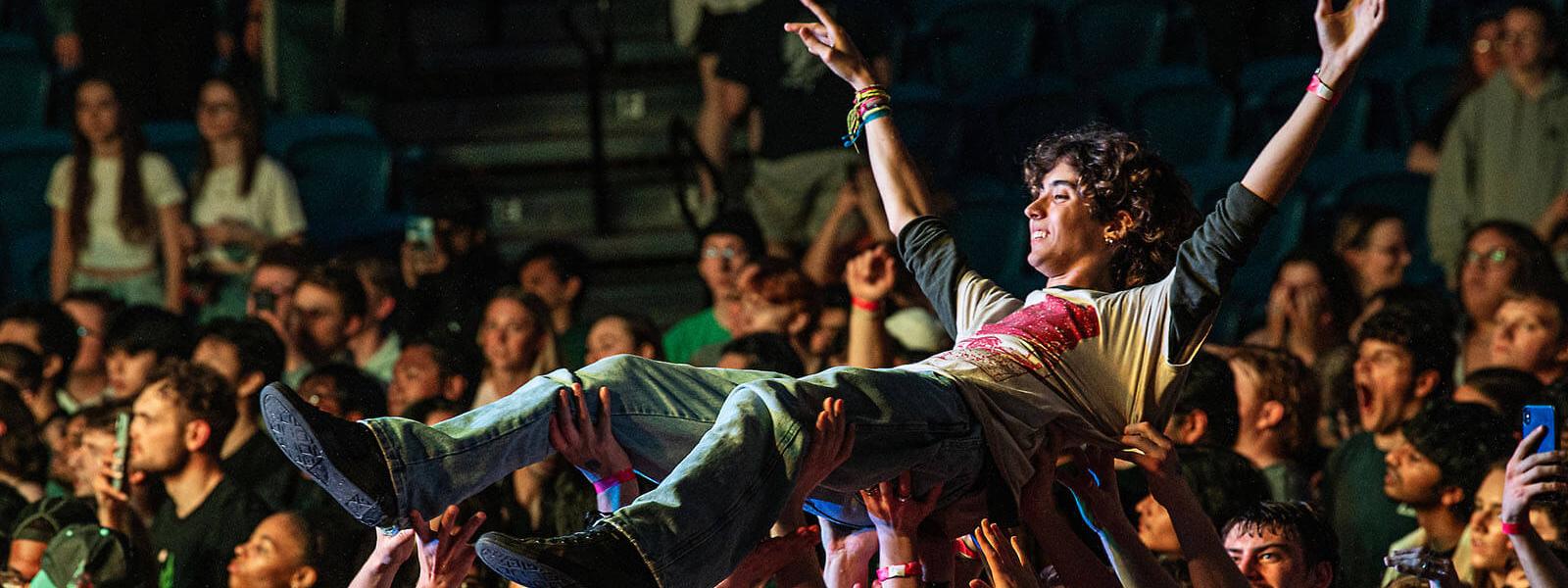 Crowd surfing at a Flo Rida concert