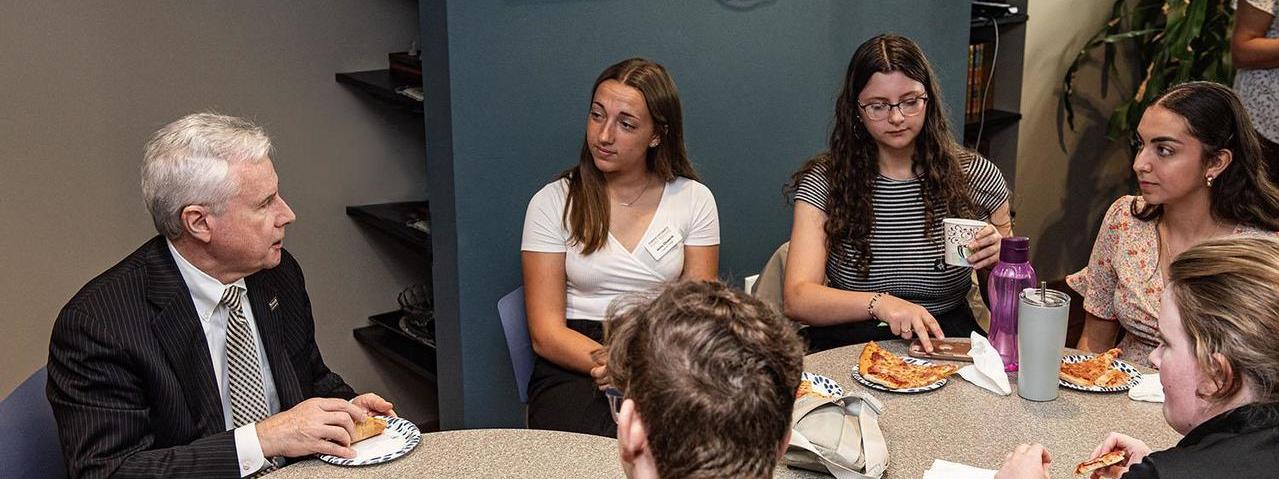 Summit Scholars speaking with the Chancellor.