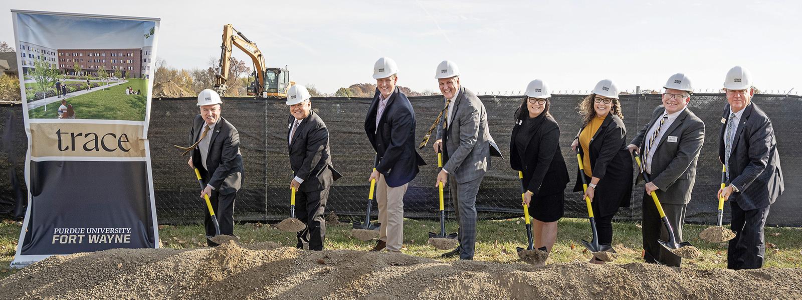 Turning over dirt at the Student Housing groudbreaking