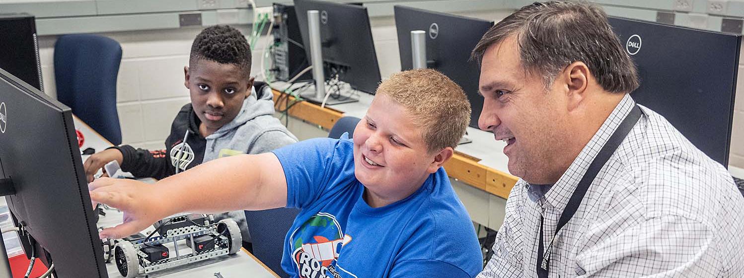 Jeff Nowak is working with students at a summer camp