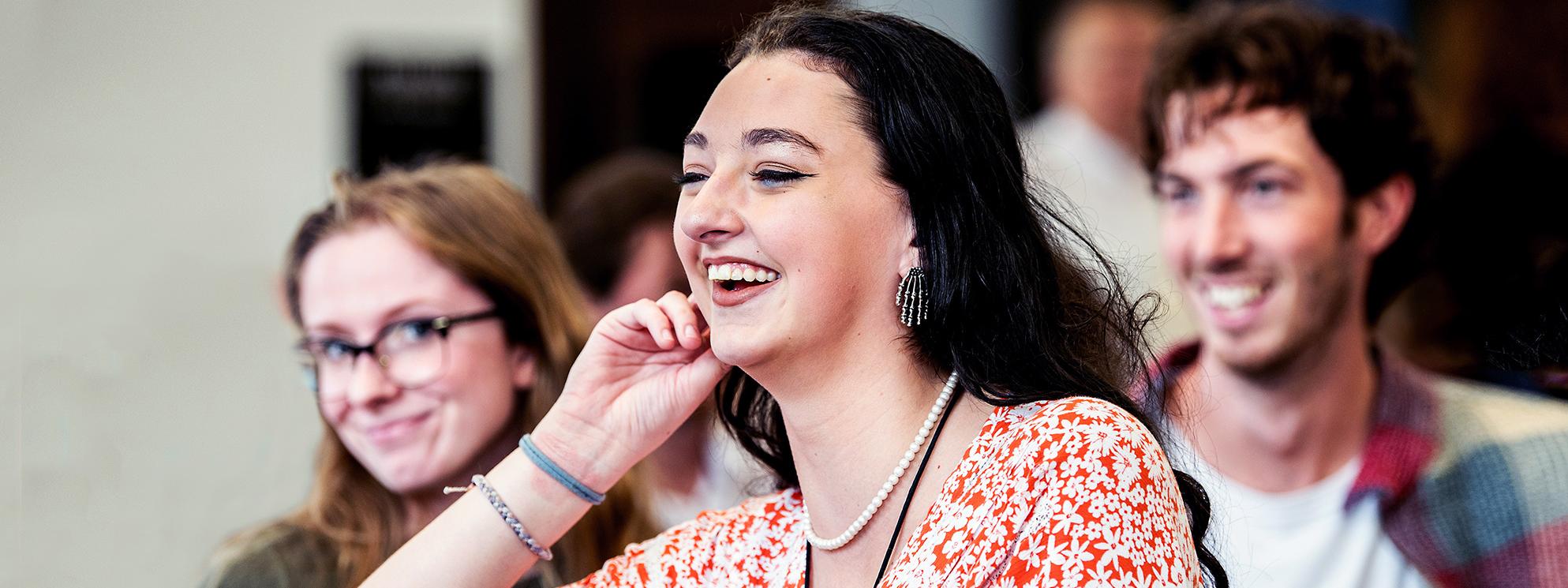 PFW students laughing and engaging with a lecture.