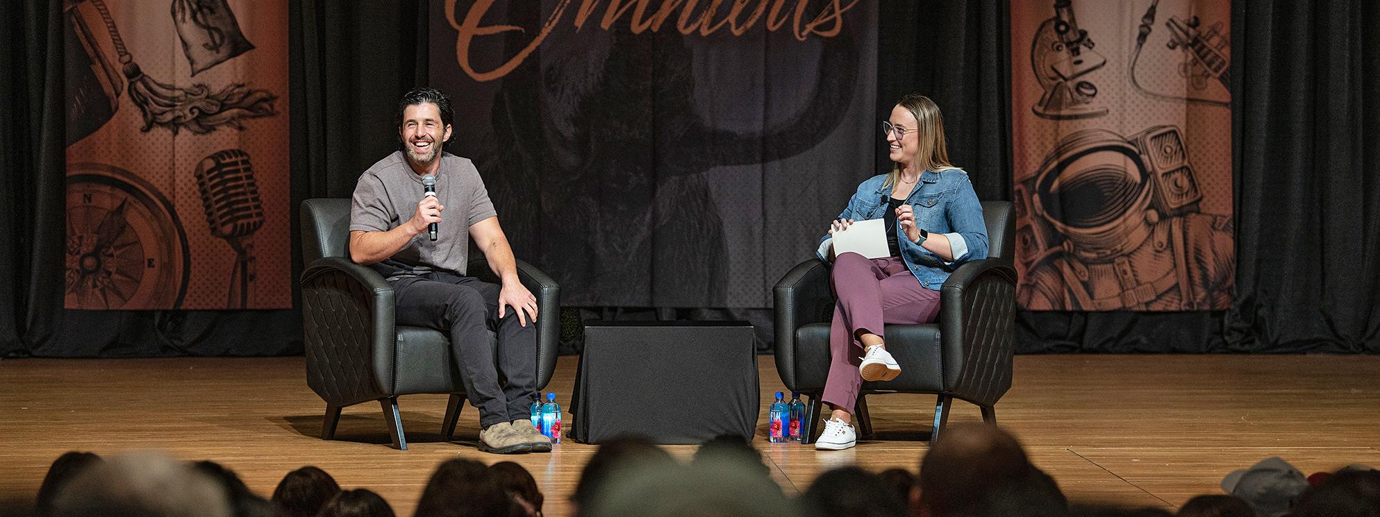 Josh Peck and moderator on stage during an Omnibus event