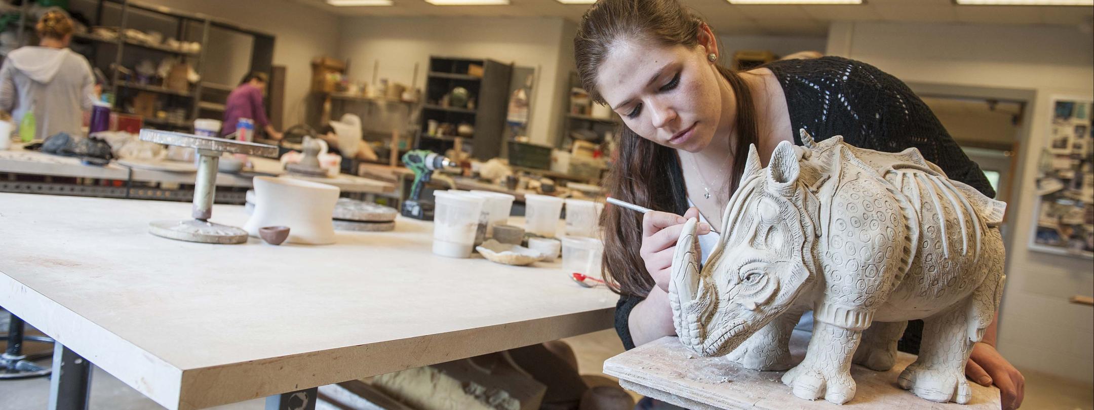 Visual Arts student working on her sculpture.