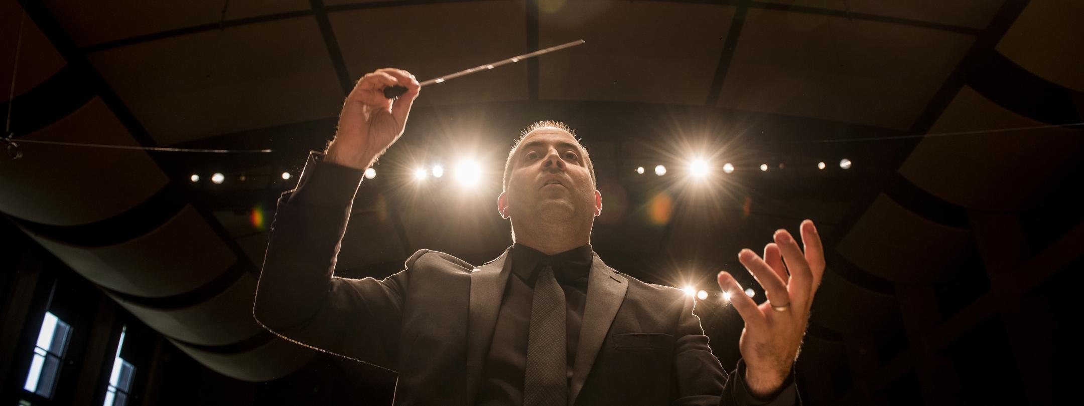 Concert director directing the orchestra.