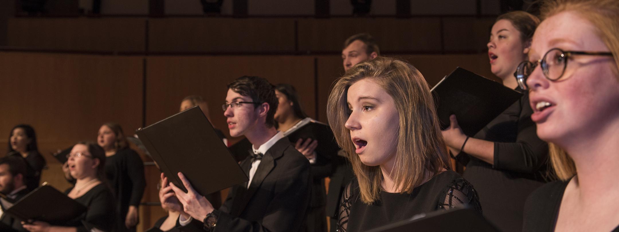 Students performing on stage.