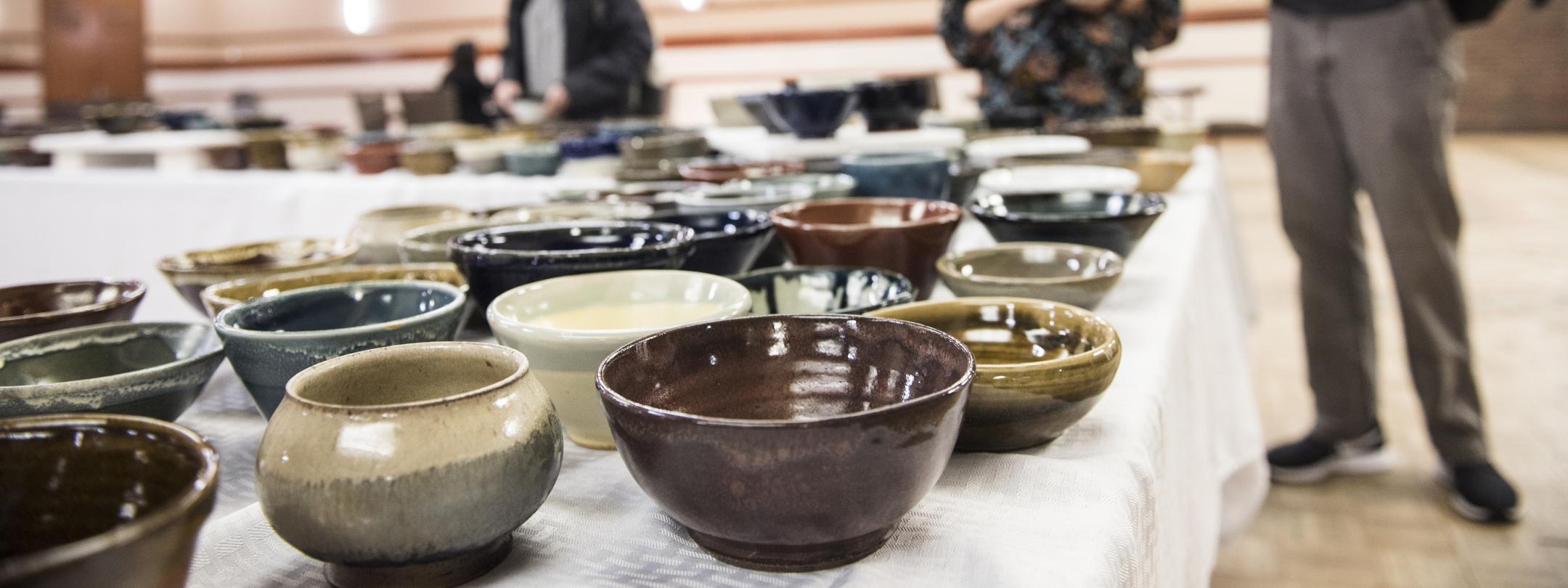 Table full of ceramic bowls.