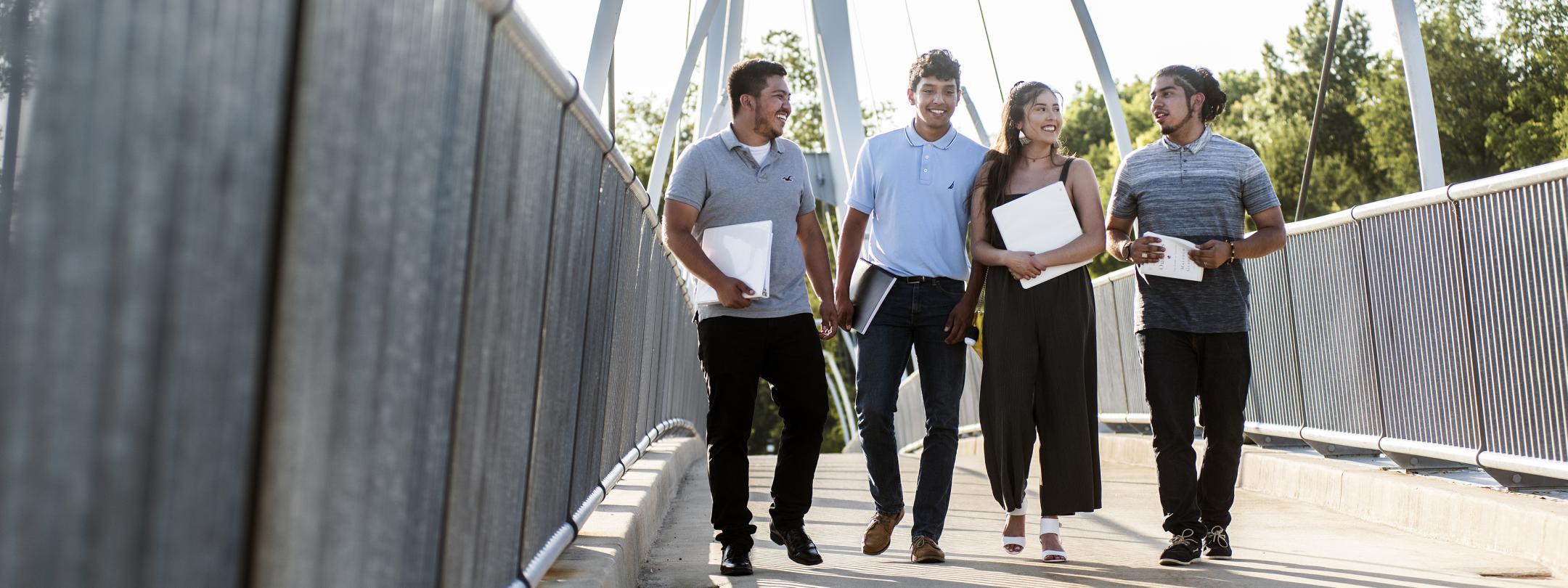 Students walking across the Venderly bridge.